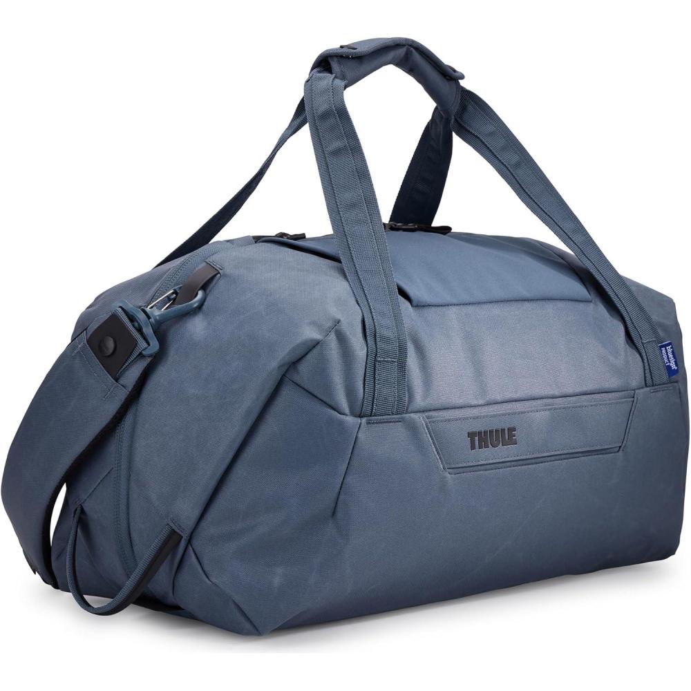 imageThule Aion 35L Duffel  Waterresistant waxed canvas  Fits 16quot MacBook  Internal divider ampamp separate compartment for dirty clothes  Multipurpose bag for travel ampamp daily commuteDark Slate